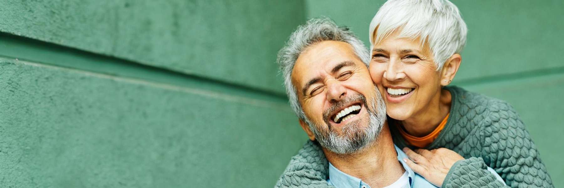 Couple smiling after getting crowns in Audubon, NJ