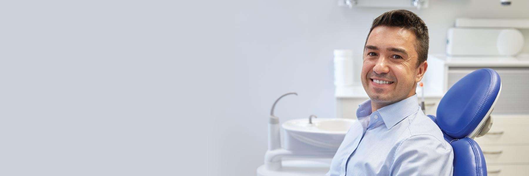 A patient smiling after getting dental implants in Audubon, NJ 