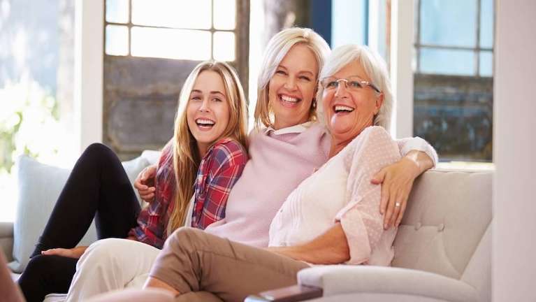 Family sitting together smiling after general dentistry Audubon, NJ