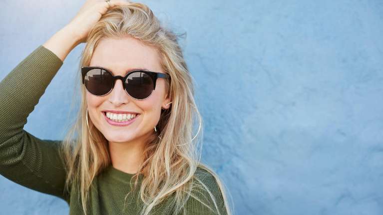 Lady smiling after cosmetic dentistry session at Train Station Dental
