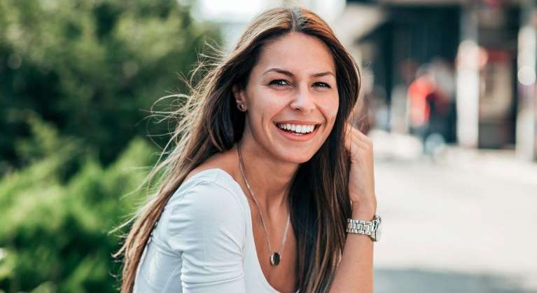 Lady smiling after cosmetic dentistry at Train Station Dental