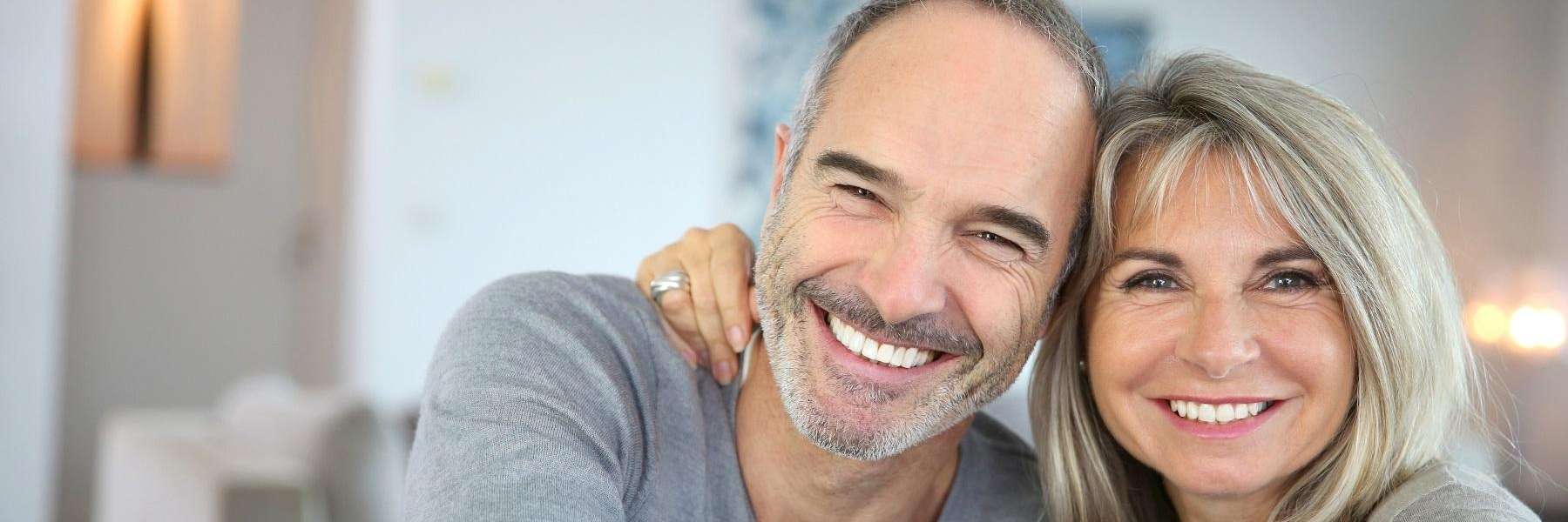 Couple smiling after teeth whitening in Audubon, NJ