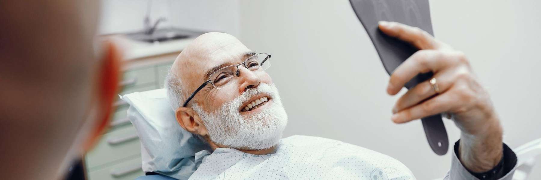 a middled aged man getting top-quality dental implants in Audubon, NJ